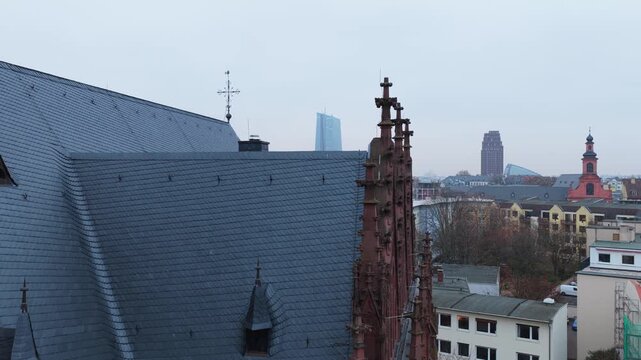 Aerial perspective revealing Frankfurt skyline from Dreikonigskirche, with European Central Bank and Main river behind gothic church