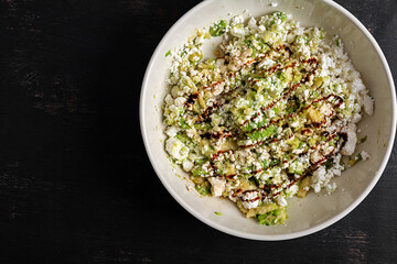 Avocado ricotta salad appetizer with soy sauce. Healthy food. Top view.