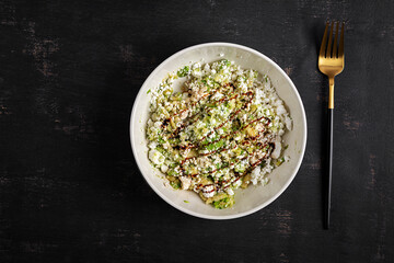 Avocado ricotta salad appetizer with soy sauce. Healthy food. Top view.