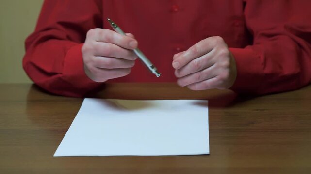 A person can't concentrate enough to start working. Close-up of hands, anxiety and stress, burnout at work