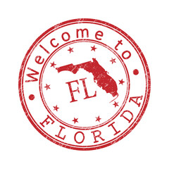 Welcome to Florida. A worn stamp with a silhouette of the state and an abbreviated designation. Print impression, a template for creative design