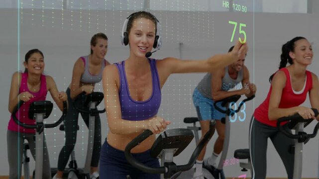 Coach leading spin class, raising arm cueing pace while ECG overlay pulsing HR or RR or SpO2 with pe