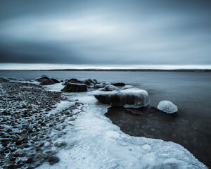Ice forms on the shoreline of Lake Femunden in Norway during winter months
