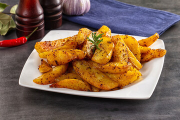 Baked crispy hot potato with rosemary