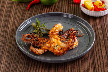 Gourmet grilled whole octopus served lime