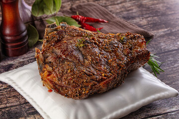 Baked beef steak on the bone