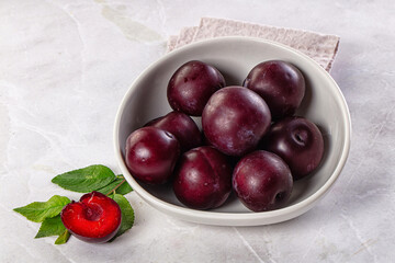 Raw ripe purple plum heap
