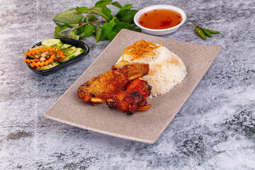 Spicy roasted chicken wing with rice