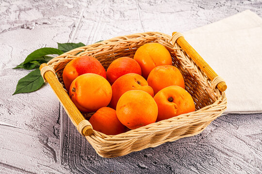 Raw ripe sweet apricots heap - Powered by Adobe