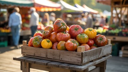 Fresh colorful organic heirloom tomatoes in a wooden crate at an outdoor farmers market on a sunny day