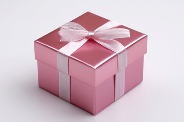 Fototapeta premium Glossy pink gift box with ribbon on white background