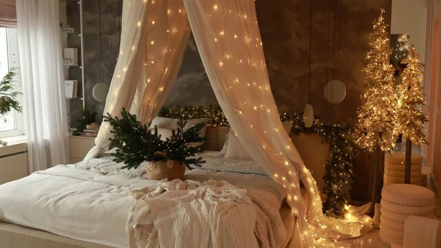 Warm evening in interior bedroom with bed with baldachin, decorated christmas tree and illimination many glowing golden lights garland. Basket with branch fir. Cozy Christmas at home. New year night	
