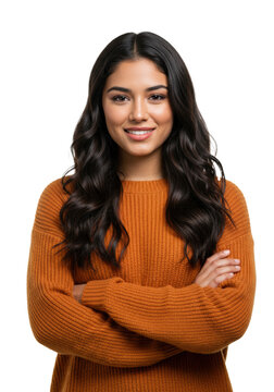 beautiful young hispanic woman in oversized orange knit sweater, arms crossed, warm smile, isolated against white studio background under high-key light. concept of youthful confidence