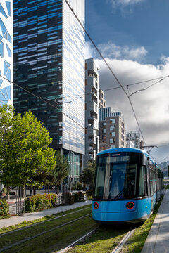 Modern urban transport infrastructure with tram system in Oslo city street, showing contemporary mobility, europe context and clean public transit design