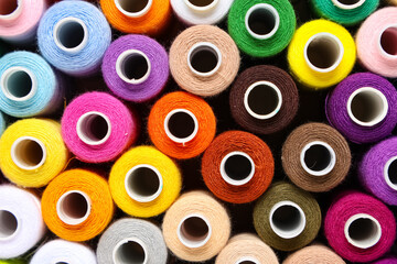 Many different thread spools as background