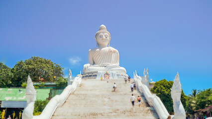 Phuket Big Buddha statue. afternoon light sky and blue ocean are on the back of white Phuket big Buddha is the one of landmarks on Phuket island Thailand.