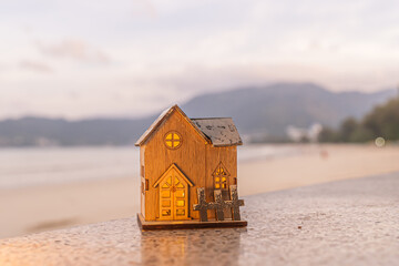 Merry Christmas word in wooden on the beach of tidewater green tone background, wide banner, Christmas banner, happy concept, copy space, soft focus Sky in the morning, Patong Beach, Phuket Thailand