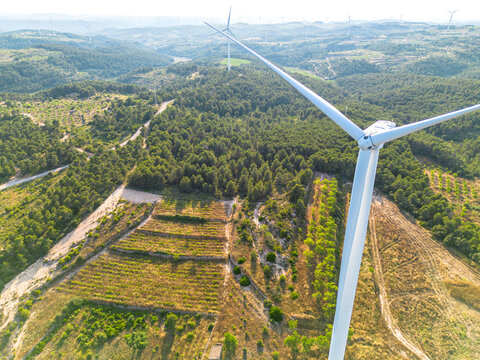 Renewable energy windmill wind farm captured by drone highlighting green energy sustainability and rural landscape in Terra Alta Catalonia Spain