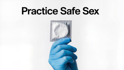 A hand holding a condom packet, blue latex glove, clinical white background, health education poster design, clear typography "Practice Safe Sex", sterile lighting, minimalist composition.