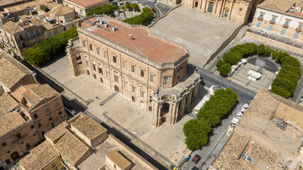 Aerial view of Palazzo Ducezio, a historic building located in the historic center of Noto, in the province of Syracuse, Sicily, Italy. It overlooks the city's main street and is home to the town hall