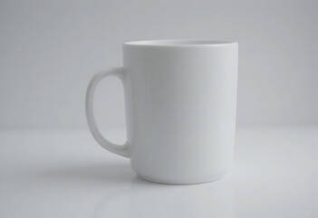 Obraz premium White ceramic coffee mug with handle on gray background