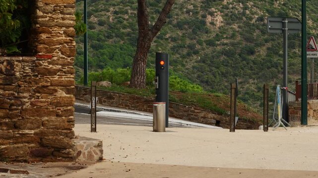Automatic bollard going up at the entrance of Saint Fran&ccedil;ois square in Bormes L&egrave;s Mimosas, France
