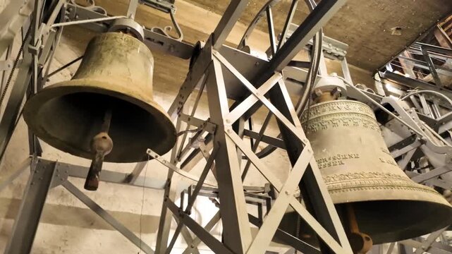 Clock tower bells inside the Lutheran Cathedral of Saint Mary in Sibiu, showcasing intricate mechanics and historic architecture.