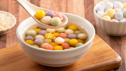 Colorful sweet glutinous rice balls tangyuan in sweet ginger syrup soup