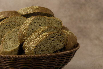 A loaf of sesame bread. The bread is cut into pieces and placed in a bowl. A meal made from flour.