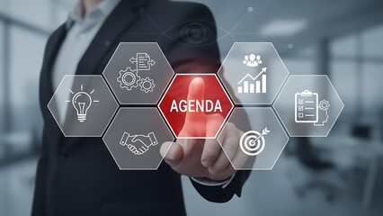 Focused businessman, in a sleek suit, initiates and highlights the agenda plan through digital interface with associated icons of tasks. Evokes a sense of strategic planning. 