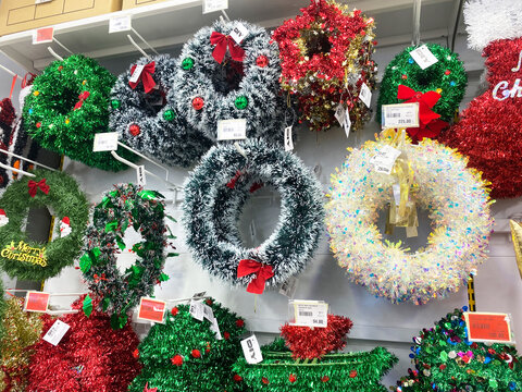 Edremit, Turkey - December 02, 2025: Colorful Christmas wreaths displayed in shop, featuring vibrant decorations and festive designs, perfect for holiday decor and celebrations