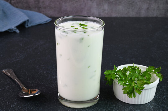 Serving buttermilk drink in a glass cup.
