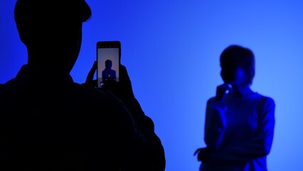 Backstage Silhouette Photo Shoot with Blue Background