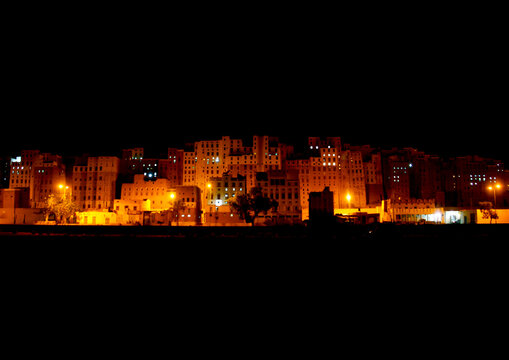 Multi- storey buildings made from mud at night, Hadhramaut, Shibam, Yemen