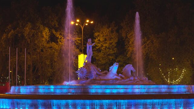 Madrid, Spain - December 30, 2025: Illuminated Fuente de Apolo fountain at night in Madrid, Spain