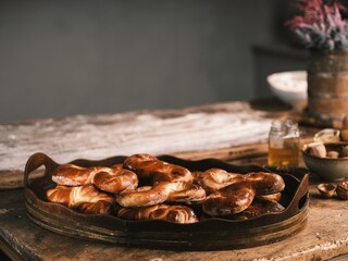In a cozy Romanian kitchen, the aroma of freshly baked mucenici fills the air