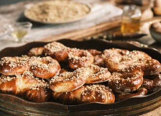 In a charming ethnographic kitchen, the warmth of a wood-fired stove fills the air as fresh braided colaci and moldavian mucenici cool on a wooden table, creating a cozy and inviting atmosphere