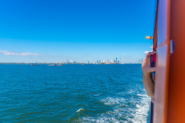 Manhattan cityscape seen from the Ferry Boat on a sunny day
