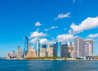 Lower Manhattan skyline seen from the water on a sunny day