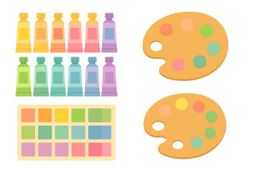 Colorful paint tubes and palettes arranged for artists in a creative studio setting