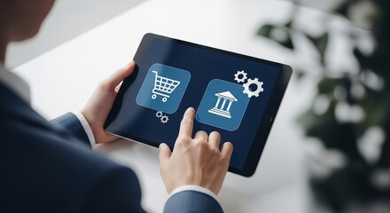 Man in navy suit touches tablet screen with shopping cart and bank icons