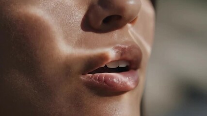 Close Up of Sweaty Skin with Light Reflection on Woman's Face Showing Open Mouth and Lip Texture in Warm Tone with Blurred Background for Beauty or Health Advertisement