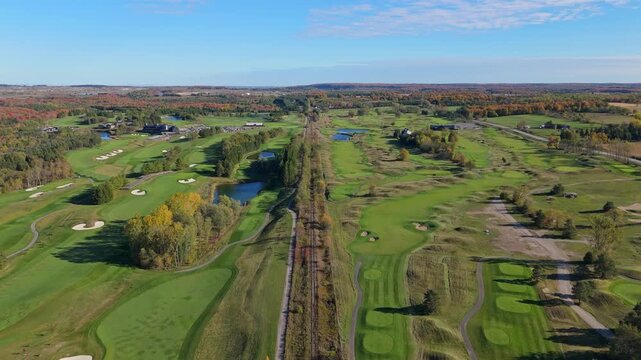 Wide aerial view of TPC Toronto at Osprey Valley, showcasing multiple championship courses, rolling fairways, bunkers, ponds, and autumn colours across the expansive golf landscape.