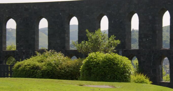 Panning mid shot left to right of the inner archways at mccaig&rsquo;s tower on battery hill at Oban