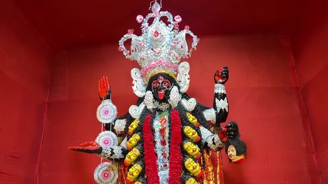 Kali Maa idol in traditional look in red background