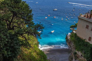 Top view from Amalfi coast of beach of Tyrrhenian Sea with blue azure water.