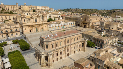 Fototapeta premium Aerial view of the historic center of the city of Noto, in the province of Syracuse, Sicily, Italy. At the center of the town is the historic center with the Cathedral of San Nicolò and the Town Hall.