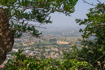 Top view of San Marino through tree branches.