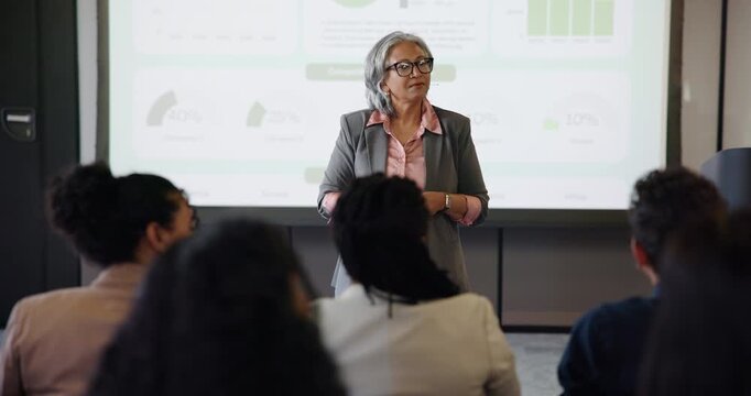 Question, mature and presentation with business woman at event for broker workshop, public speaking and teaching. Lecture, answer and keynote speaker with employees at summit for training conference