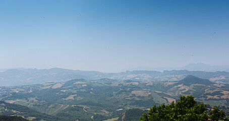Panoramic landscape of Italian land in sunny day with blue sky.